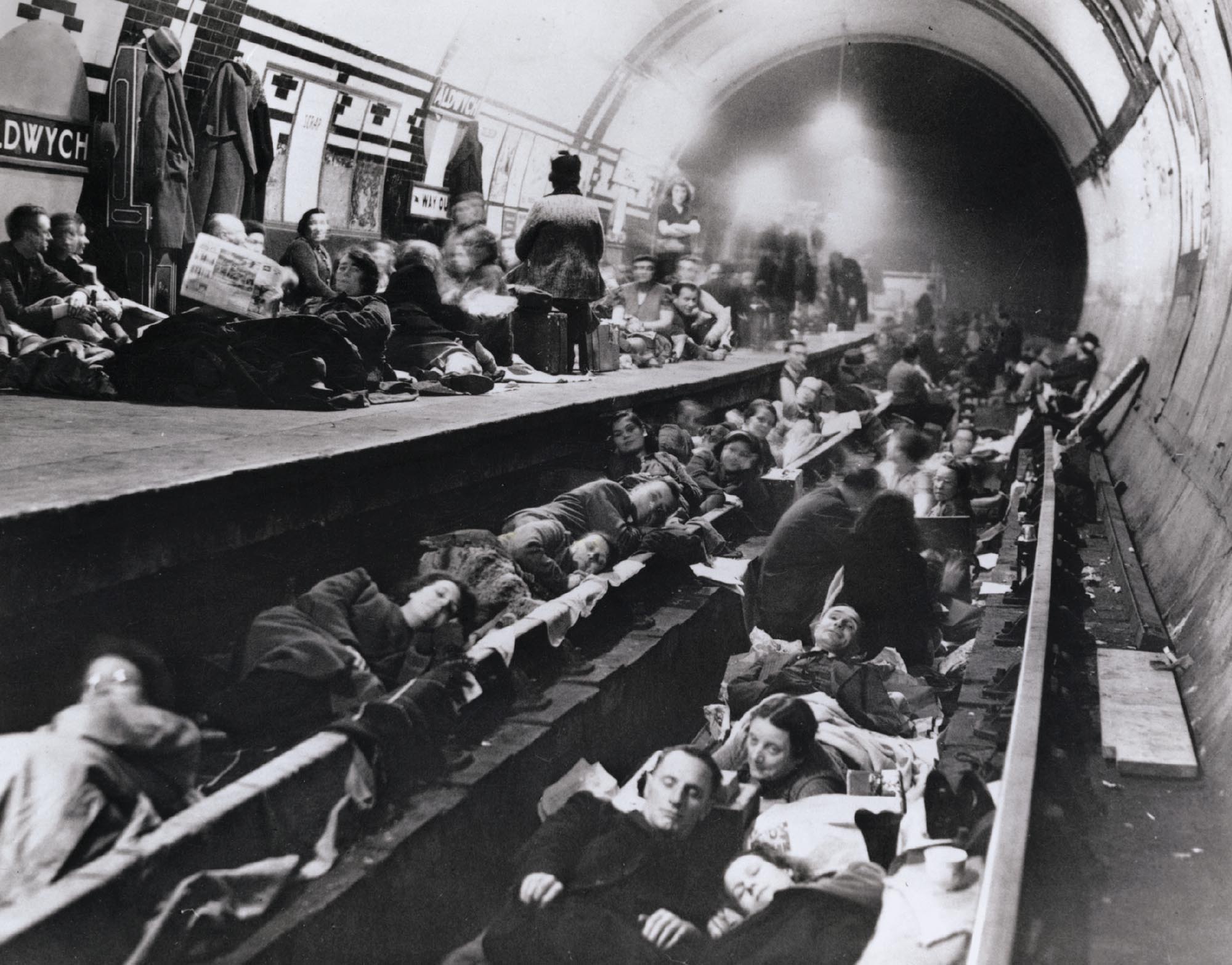 A crowd of civilians seeking shelter in the subway tunnel in London during the war.