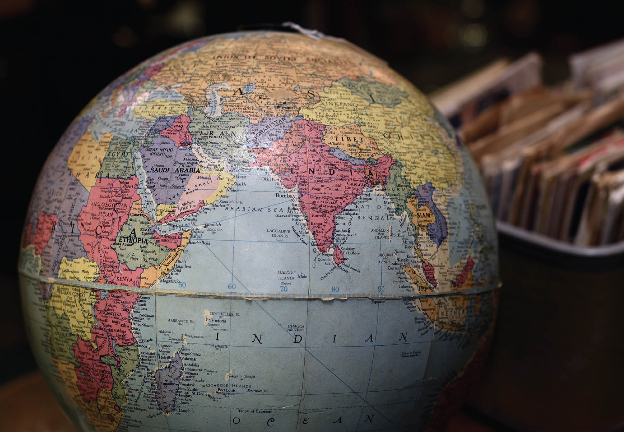 A vintage globe of the world for sale in an antique shop showing the Indian Ocean and surrounding countries.