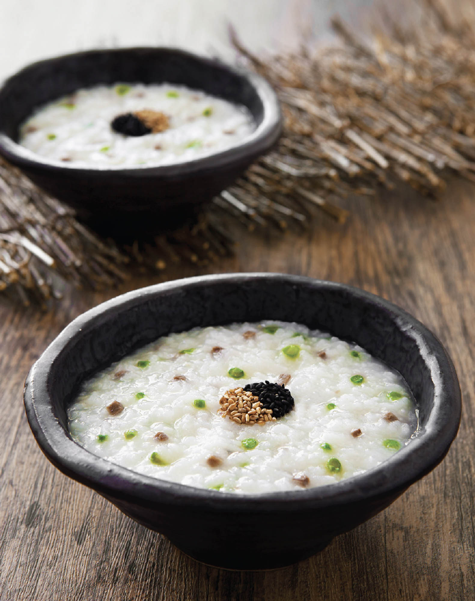 A picture containing two bowls of porridge.