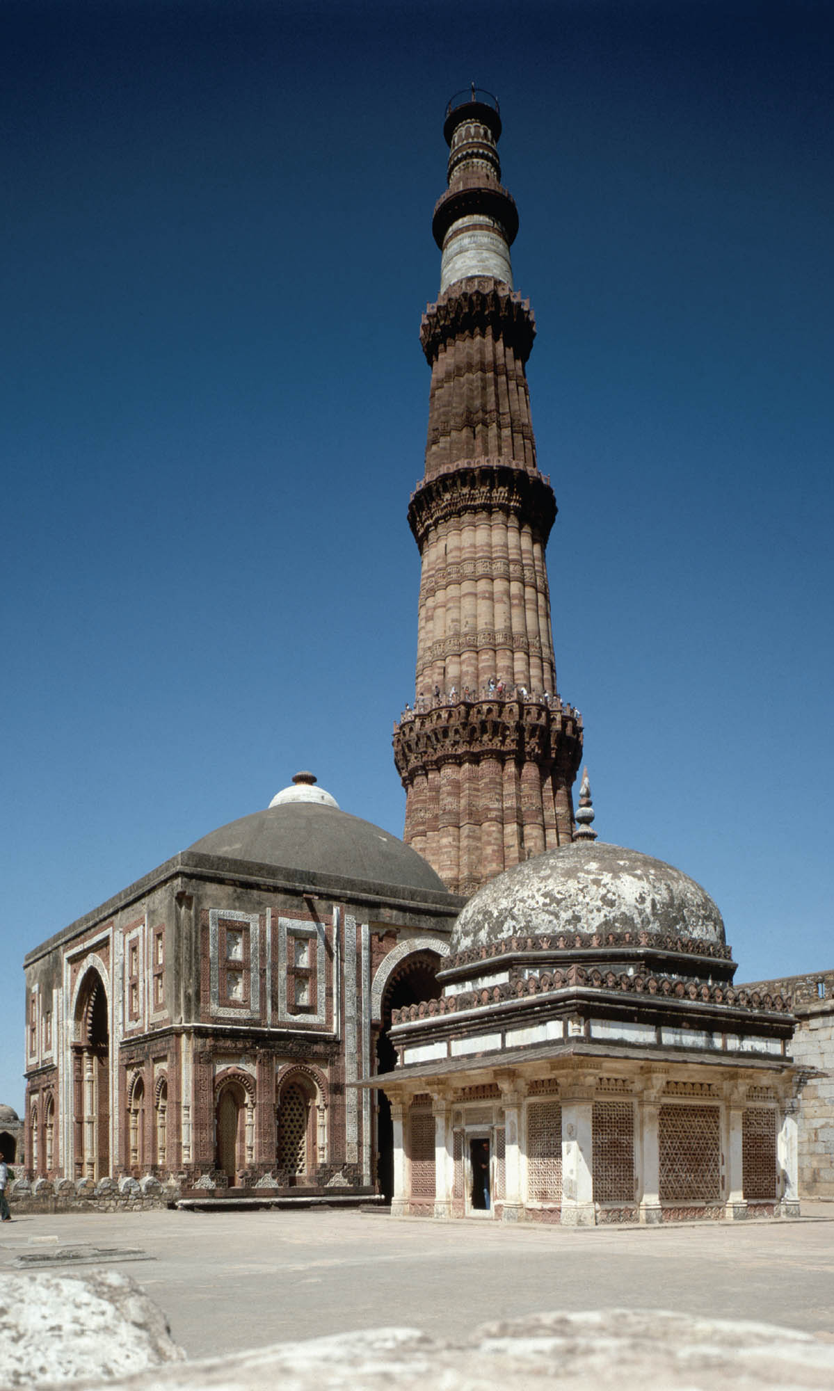 Photo of three structures built in the Islamic architectural style. Each structure is intricately detailed and colorful, with one towering high in the sky.