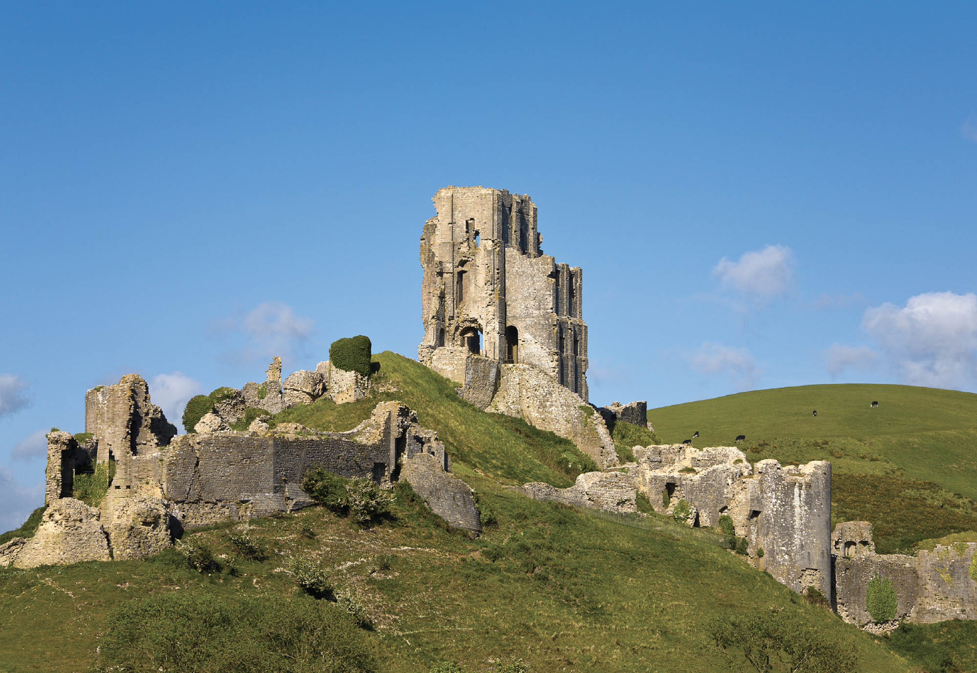 The ruins of a castle on hill in England.