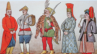 A row of five people wearing a range of colorful clothing typical for members of the court of the Sultan in Turkey in the 17th century.