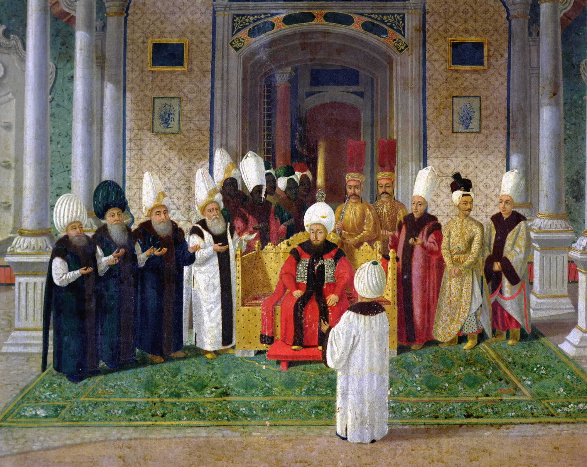 A painting depicting a formal reception at the Court of Sultan Selim III, with the Sultan seated on a throne and surrounded by various officials and attendees; all are wearing traditional headdress.
