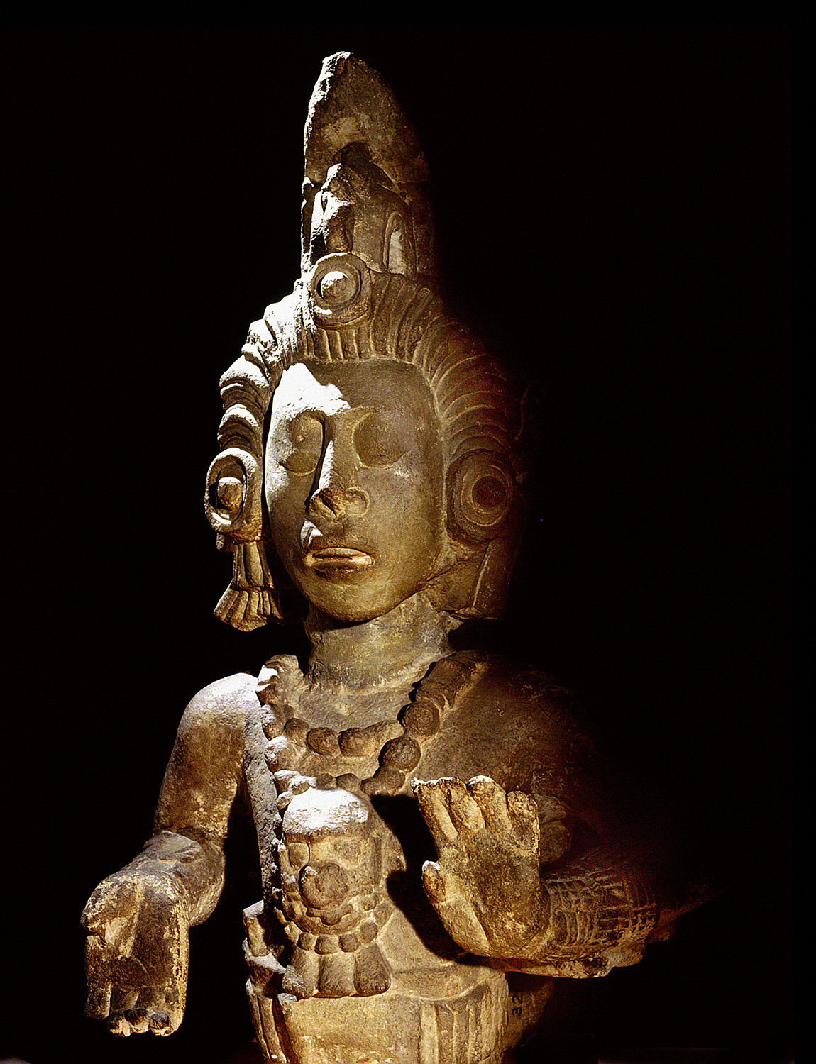 Sculpture of a maize god from the palace of Yax Pac. The god is a personified maize cob in the form of a beautiful young man, his hair the corn silk.