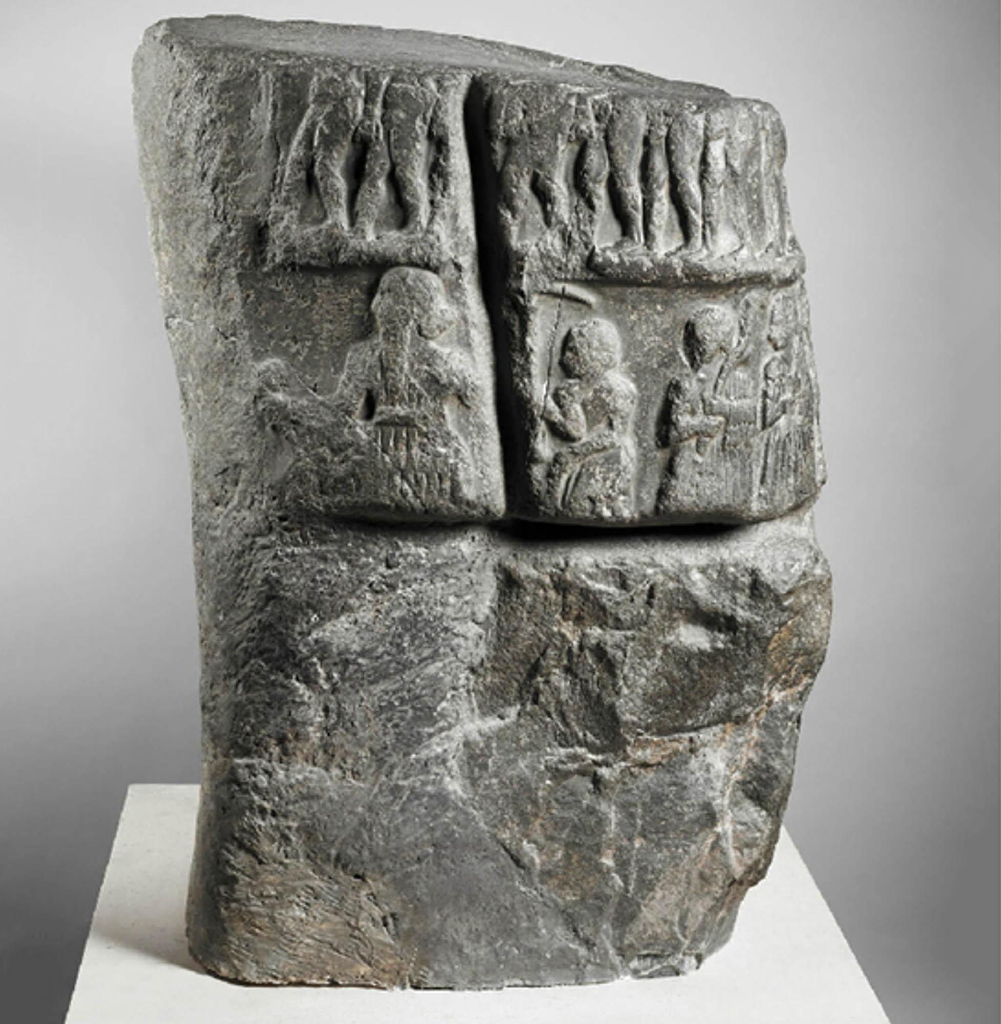 A stone carving of human figures.