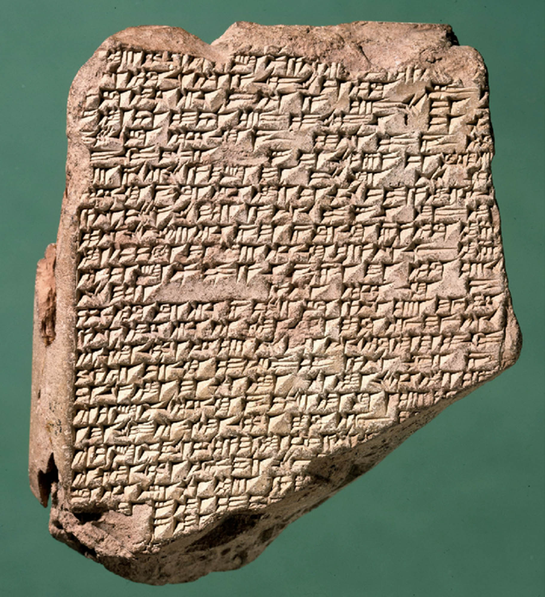 A clay tablet full of Akkadian text.