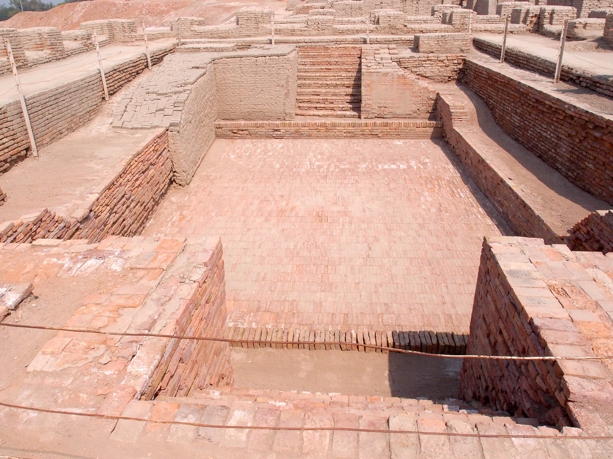 Architectural site in Mohenjo-daro featuring a large bath, made of brick.