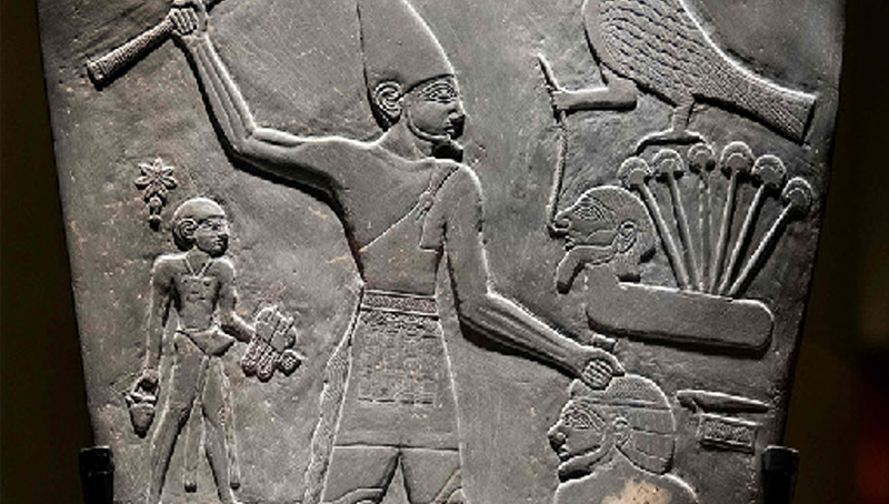 The Narmer Palette is a large, shield-shaped ceremonial stone carved from dark green-grey siltstone, dating to early ancient Egypt. It features low-relief carvings showing King Narmer, divine symbols, and early artistic conventions, including his depiction with both the White and Red Crowns of Upper and Lower Egypt. The palette illustrates royal power, religious symbolism, and the standardized proportions that shaped Egyptian art for millennia.