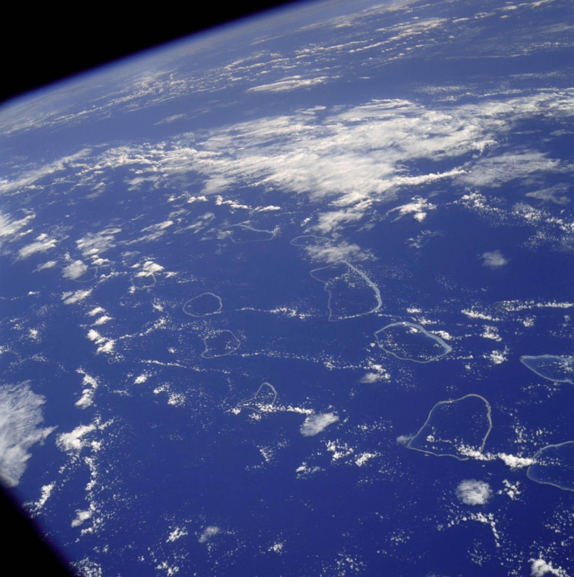 A view of the Earth from space and the Tuamotu Archipelago.