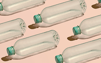 A group of plastic pet bottles placed in an row.