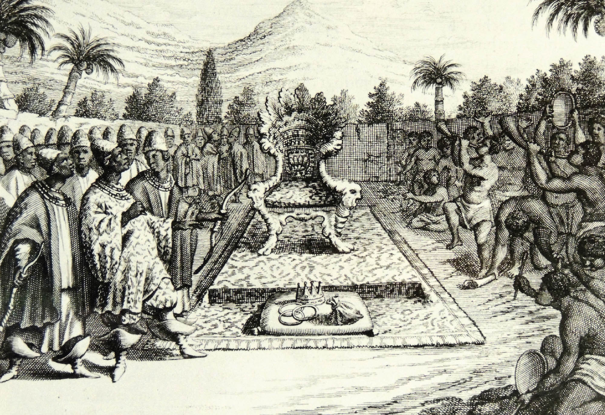 Photo of three traditional, hand-carved African masks. Each mask is painted in shades of brown, white, and black and contain different geometric designs.