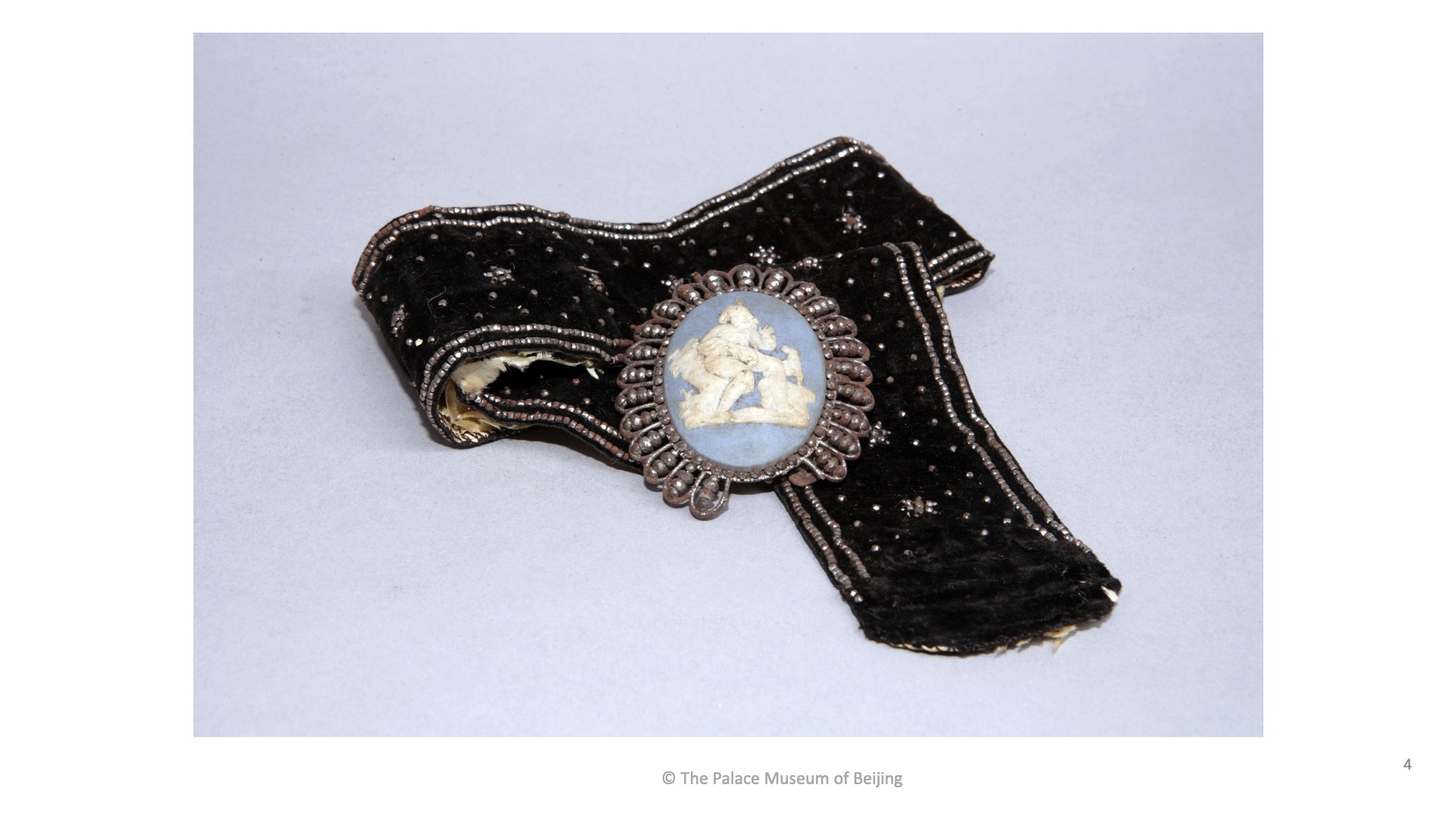 Gifts from the West: Black suede Western belt with embedded metal springs and porcelain decoration.