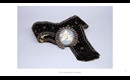 Gifts from the West: Black suede Western belt with embedded metal springs and porcelain decoration.