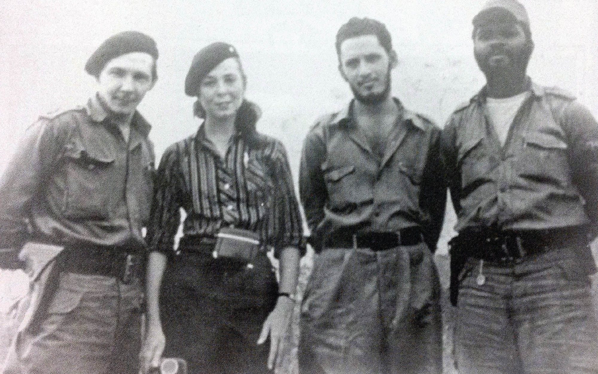 Photo of four communist revolutionaries from Cuba. From left to right: Raul Castro, Vilma Espin Guillois, Jorge Risquet, and Jose Nivaldo Causse.