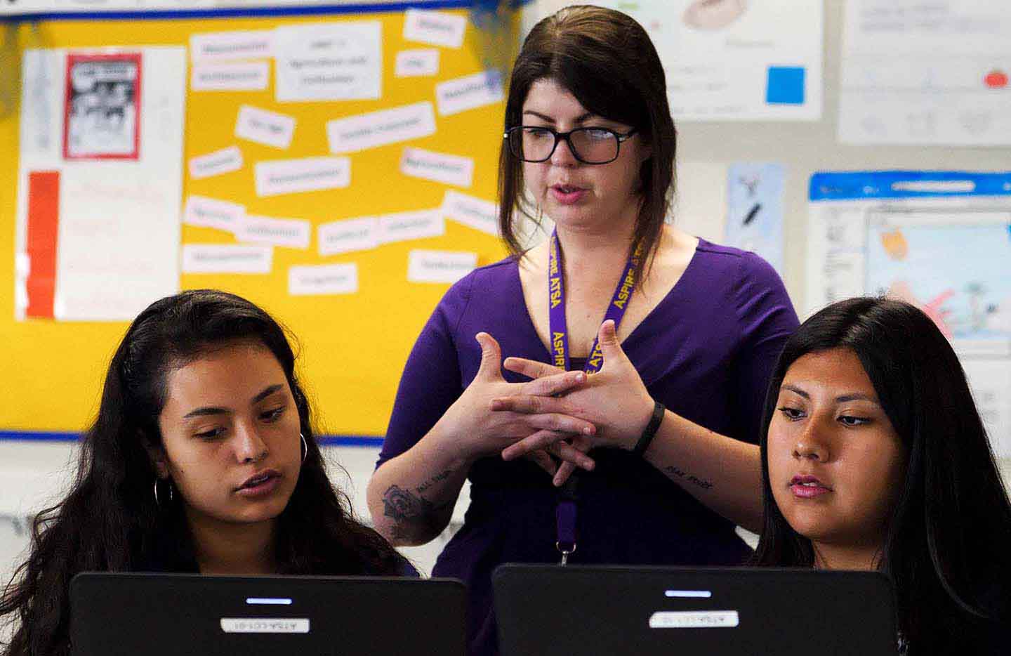 A teacher working with students
