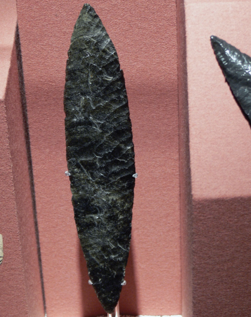 A sharpened, blackened tool carved from obsidian.