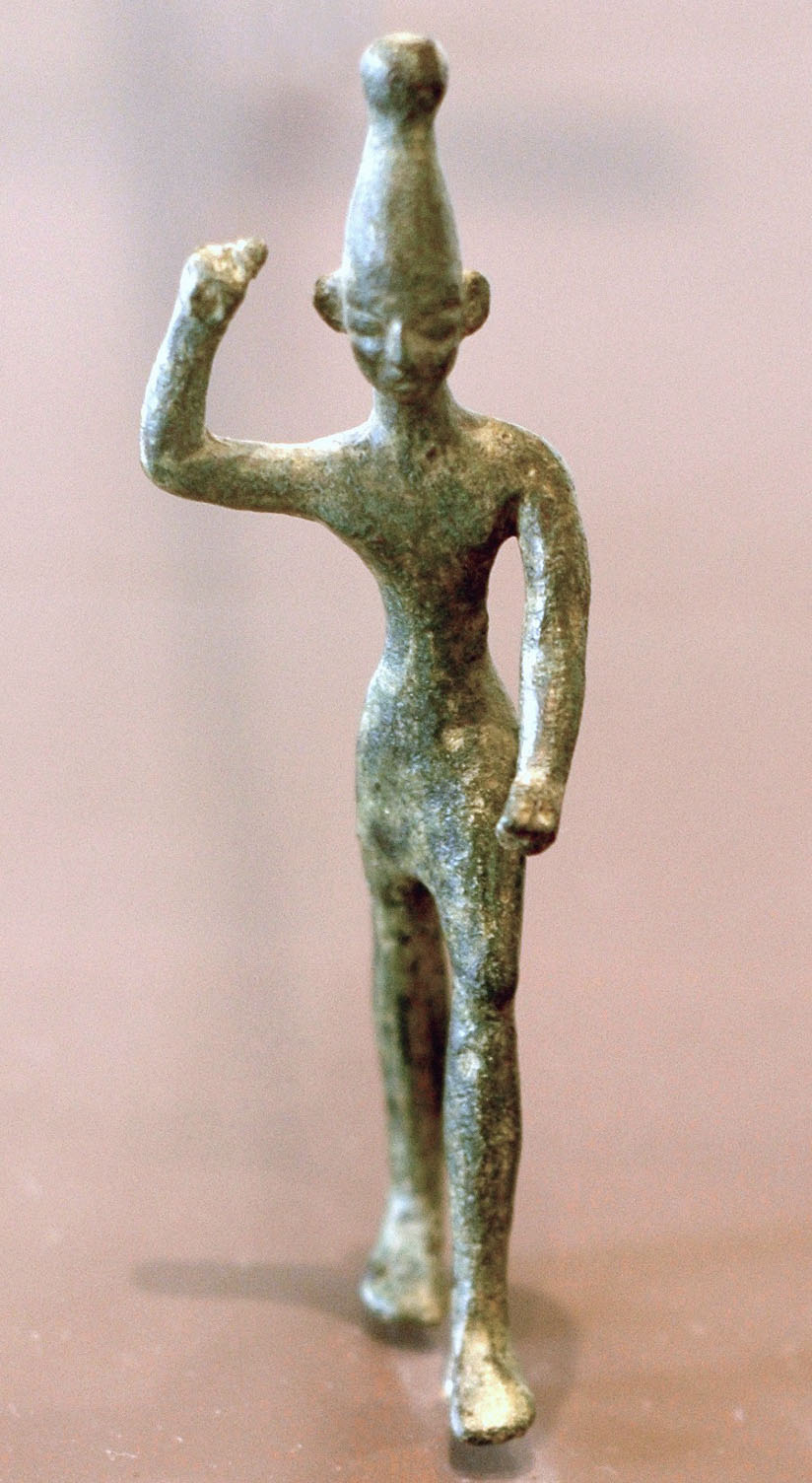 Photo of a sculpture of a person holding up one arm