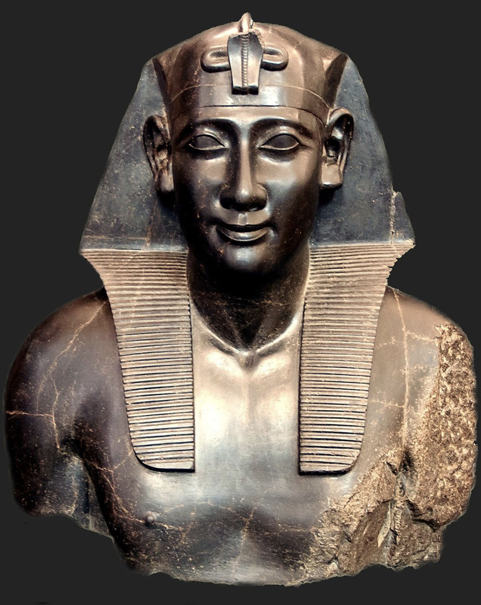 A stone bust of Ptolemy I. The face is lifelike and he is wearing an ornate headdress