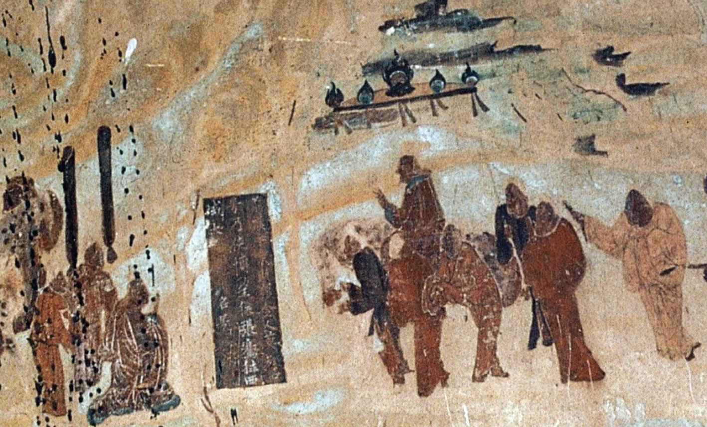 A painting depicts a man on horseback waving to a group of people. Several others are following behind him. He appears to be walking toward a tapestry, or door, containing text.