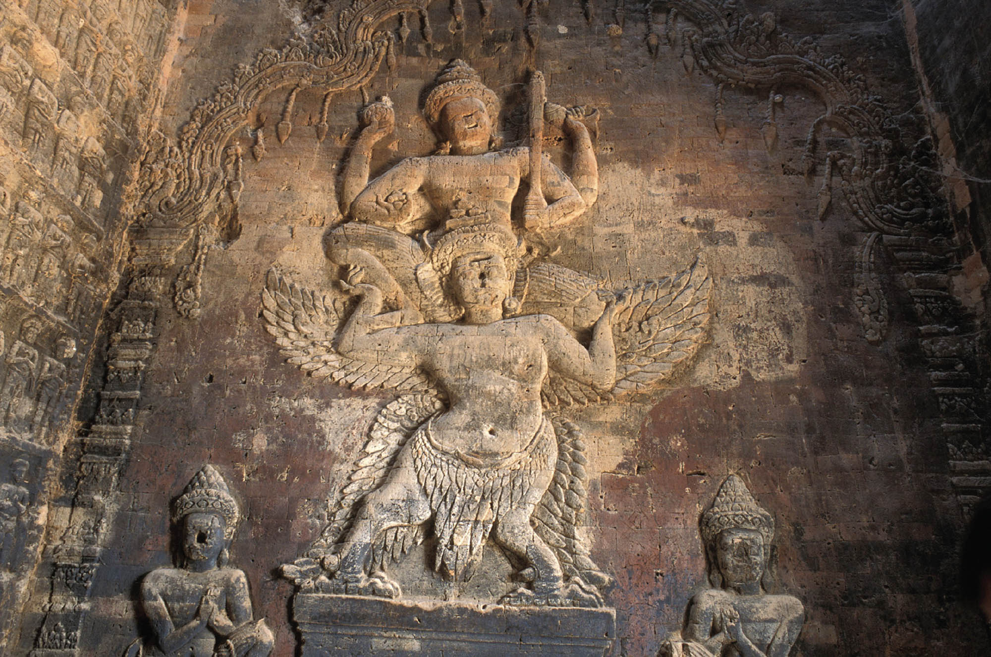 A photograph of a section of a detailed carving of the Hindu god Vishnu.