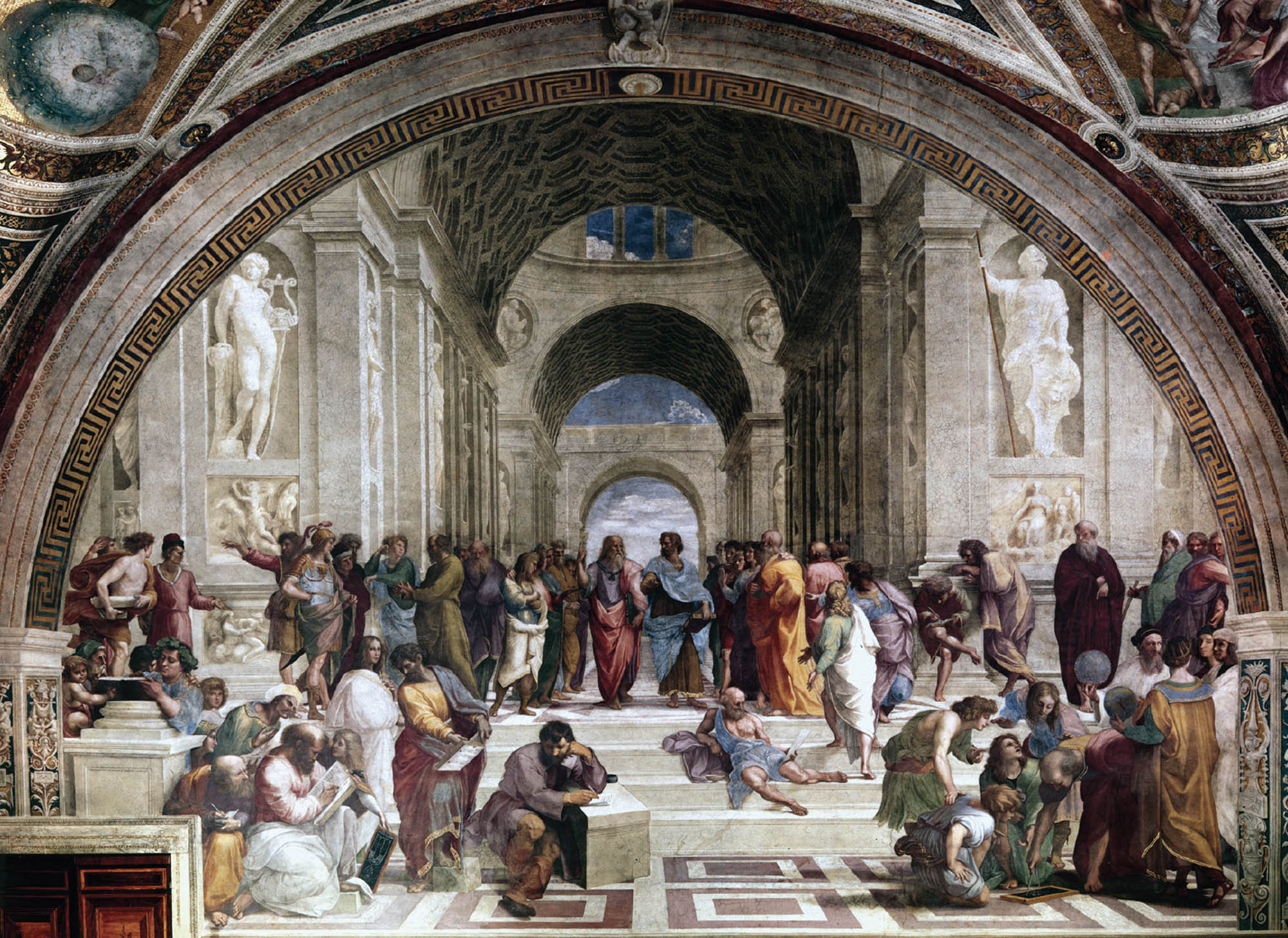 In an open-air building with many ornate archways there is a large gathering of philosophers who are engaging in various activities such as conversing, writing, reading and thinking.