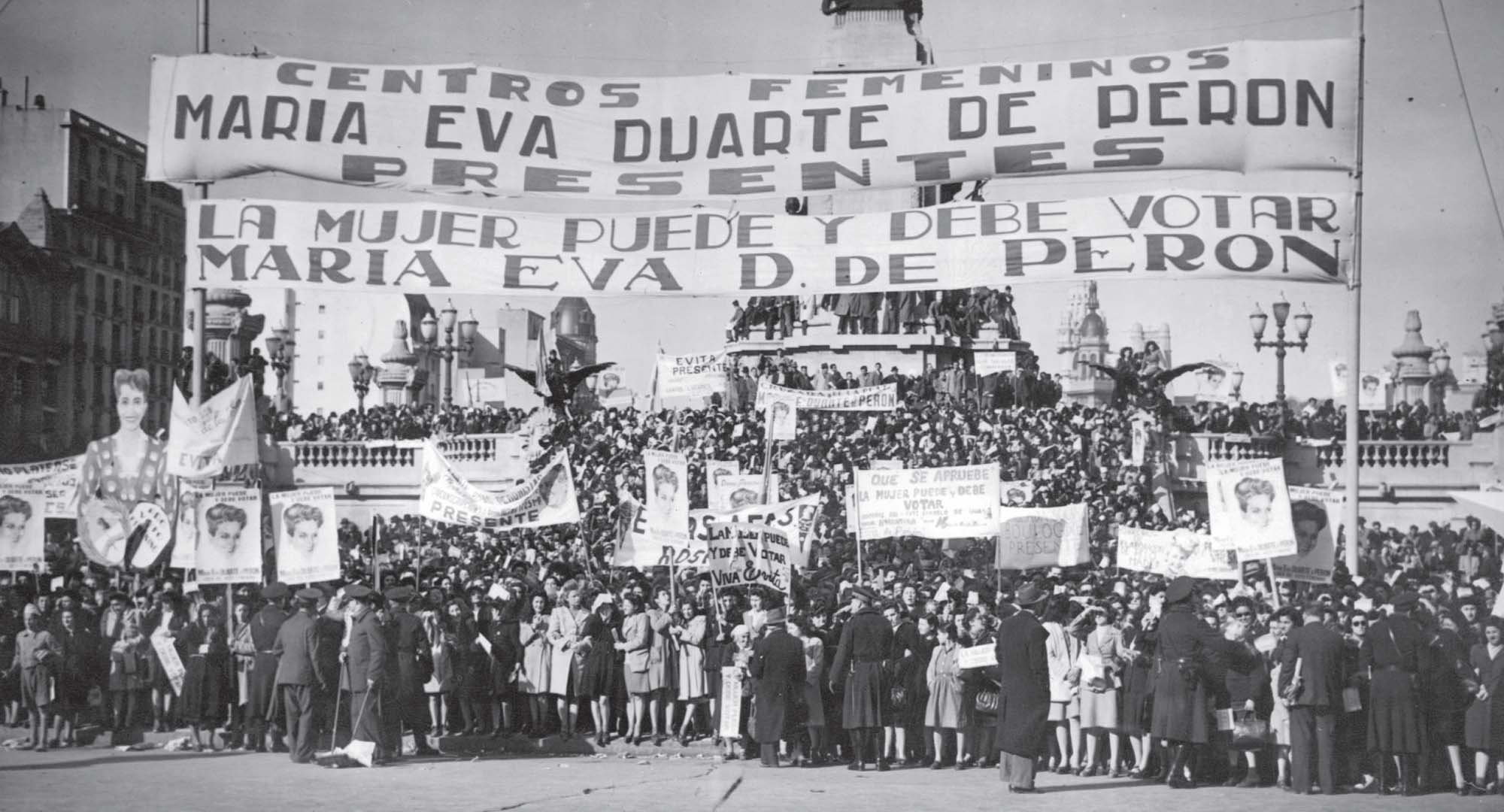 Women march at the National Congress for women’s suffrage holding signs that read “The Women’s Center Presents, Maria Eva Duarte de Peron, Woman Can and Should Vote”, 1947.