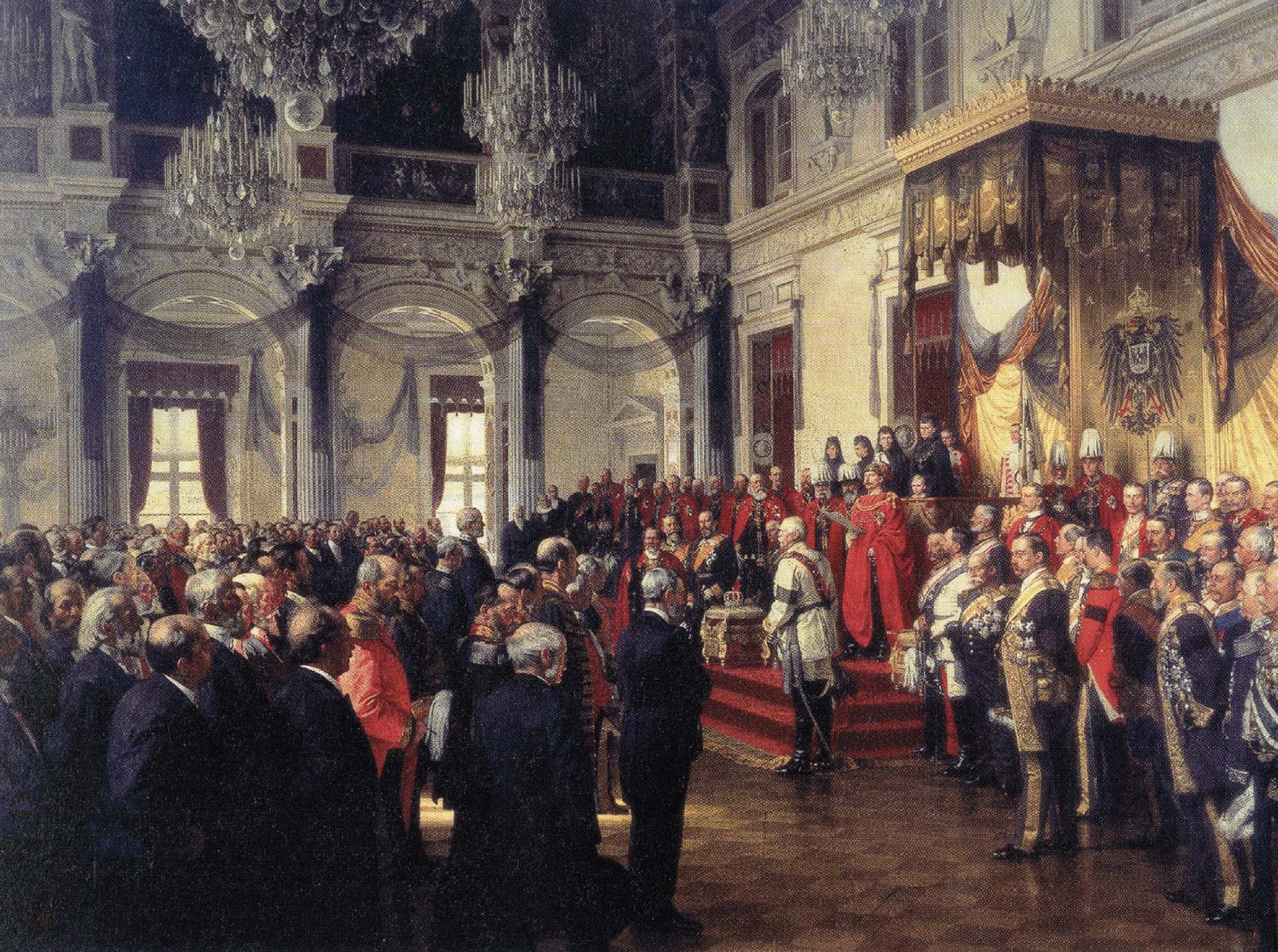 Painting of a grand hall with a crowd gathered and a man wearing red standing on a raised platform with a paper in hand and a crown before him.