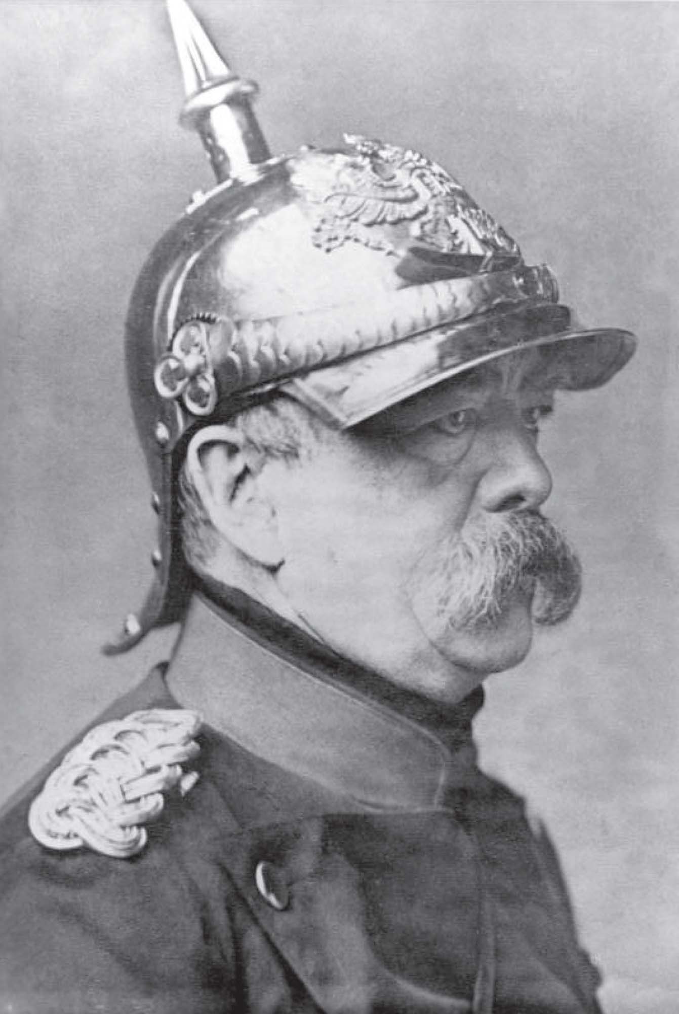 Portrait of a man in military uniform looking angrily off to the side. 