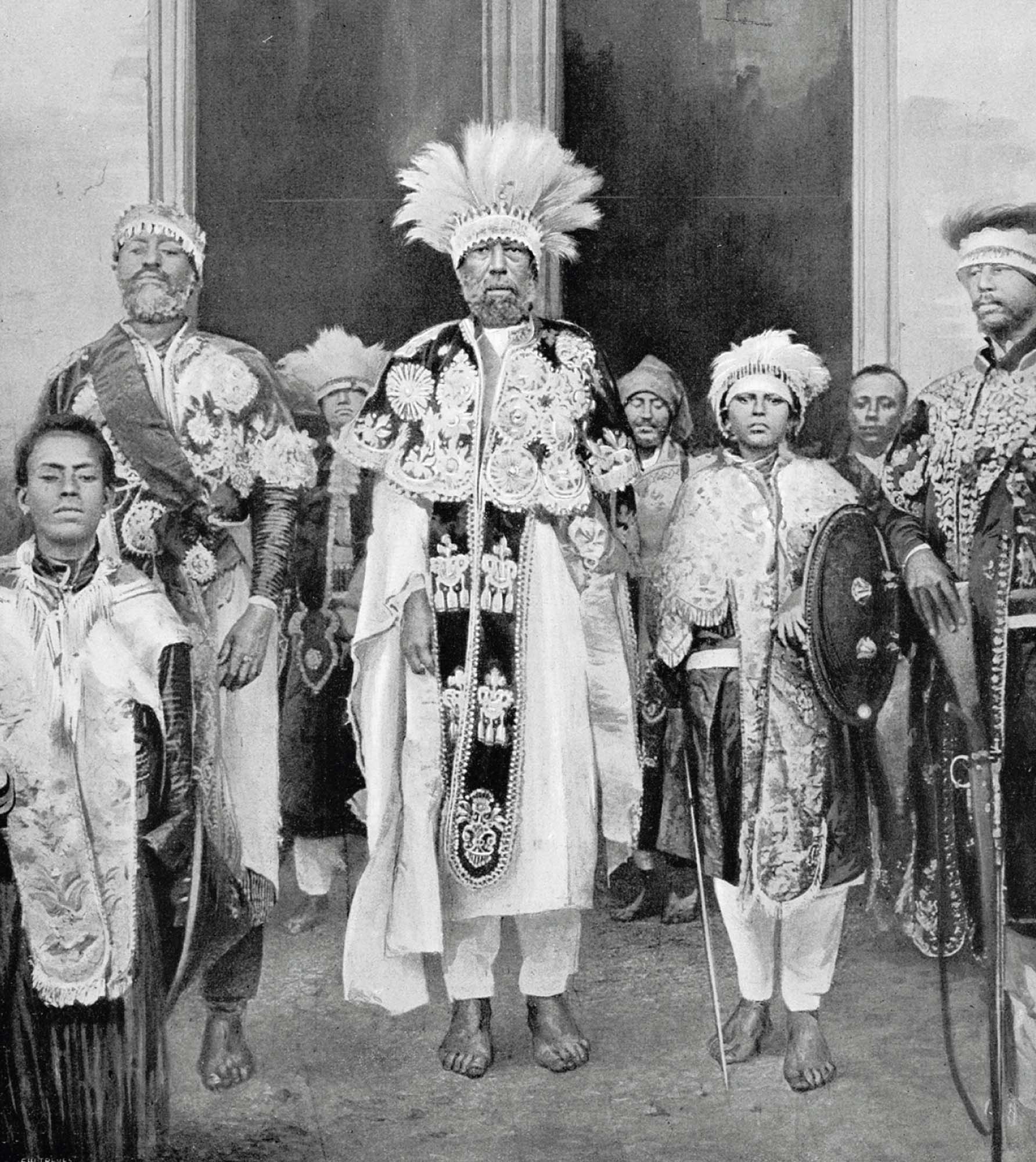 An elaborately dressed Emperor of Ethiopia, Menelik II with government dignitaries in Addis Ababa, Ethiopia. 