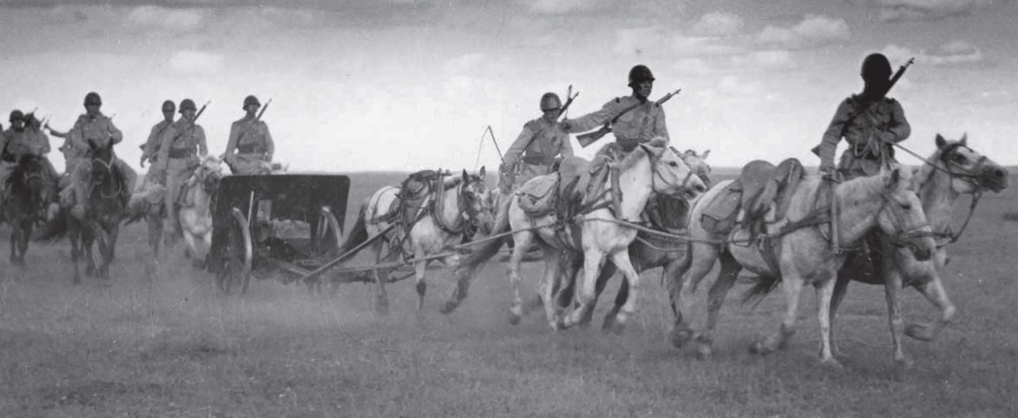 Photo of Japanese soldiers towing a 75-millimeter mountain gun on horseback.