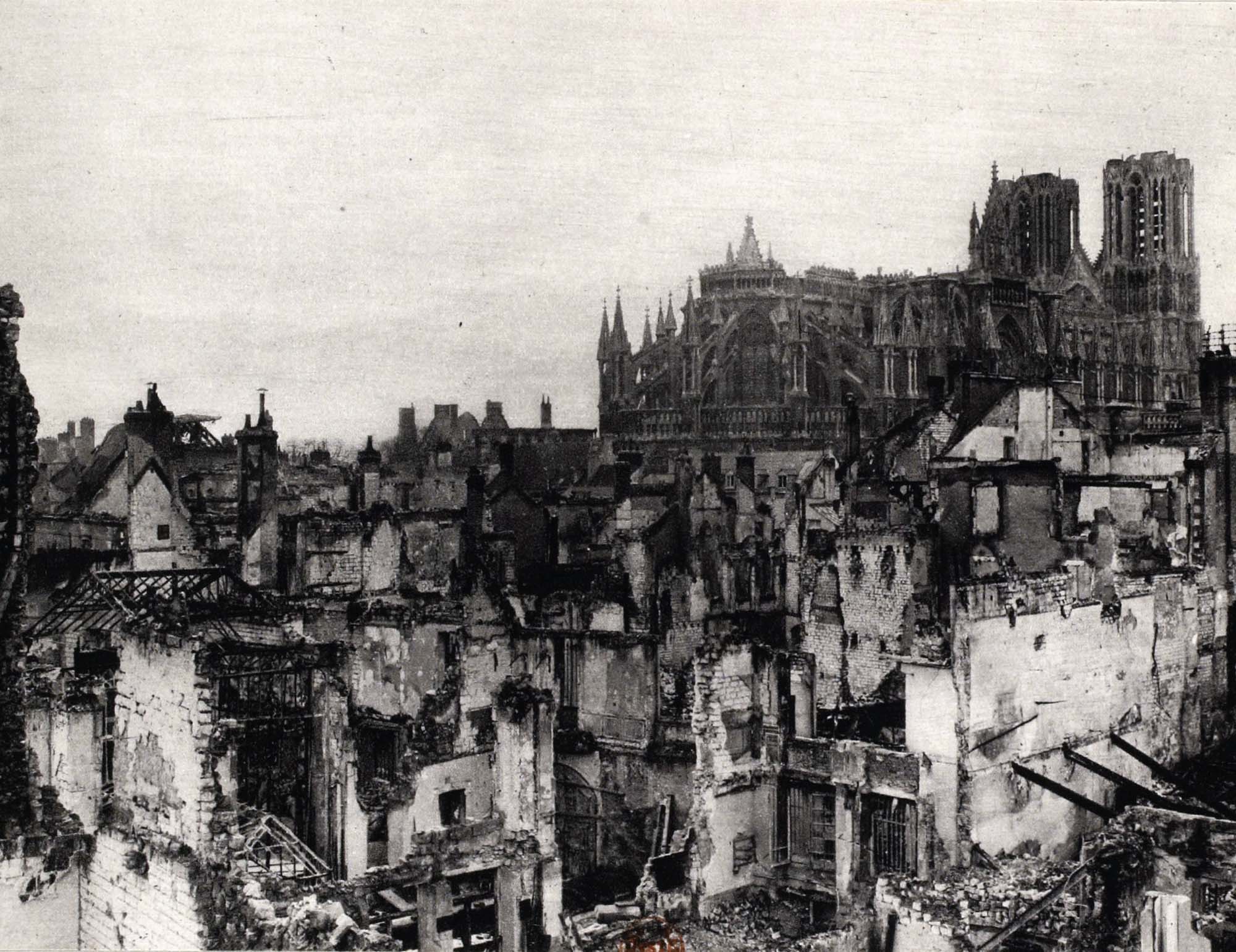 A grand castle is mostly destroyed, with many areas burned and turned to rubble.