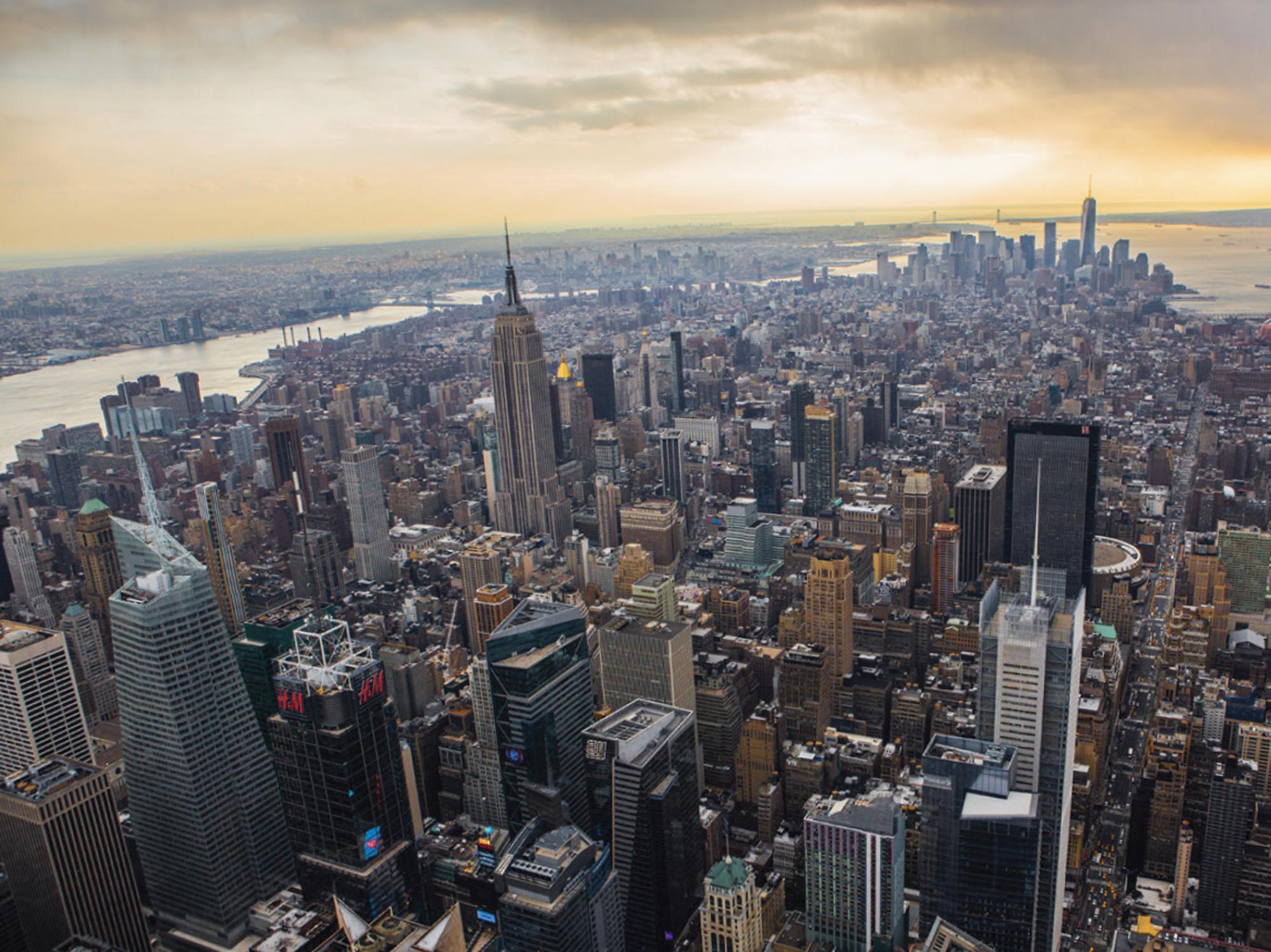 A modern-day photograph of Manhattan shows a vast number of high rise buildings.