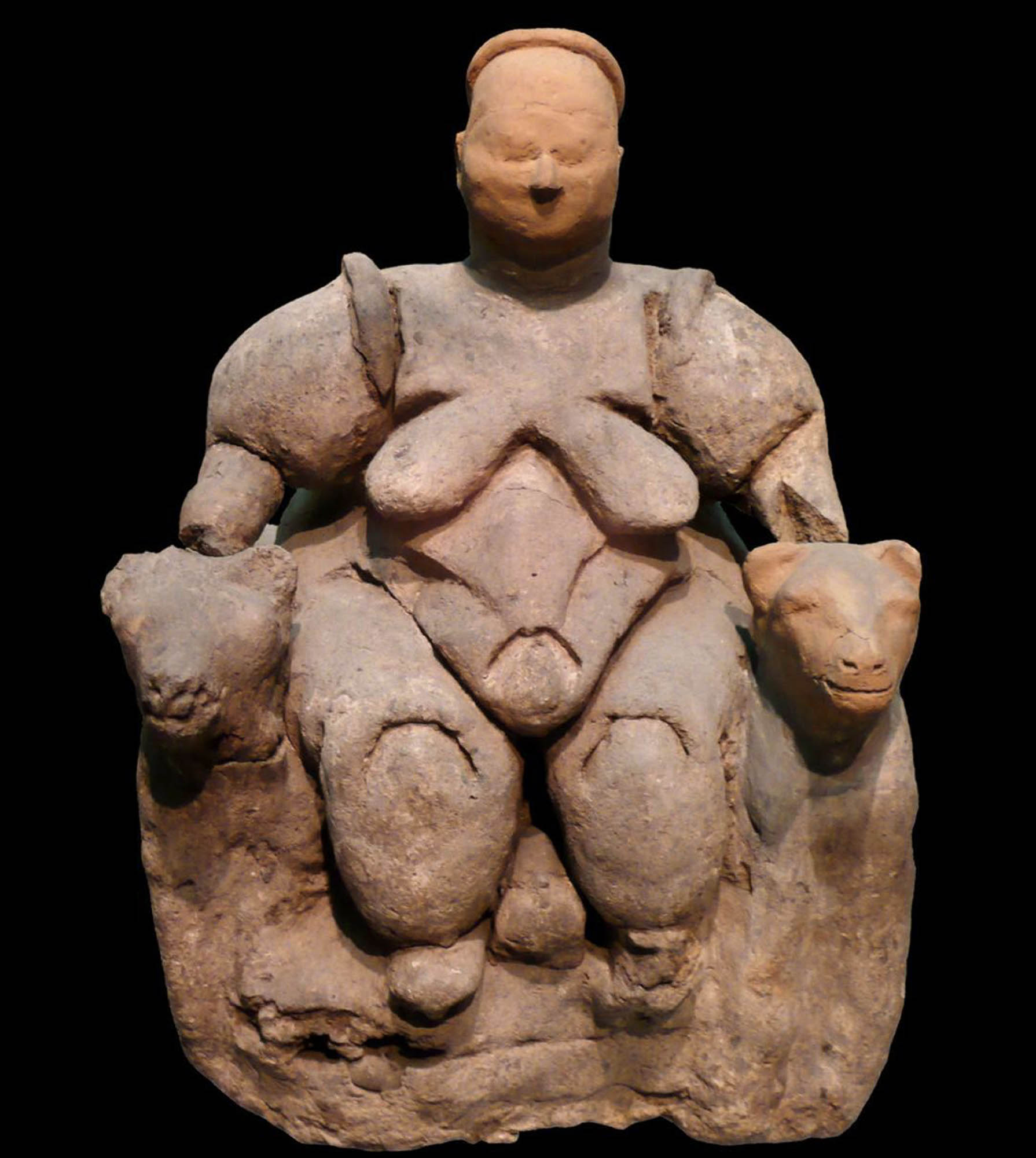 Sculpture of a large, naked woman seated on a throne.
