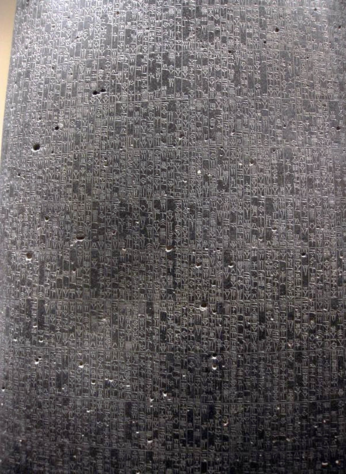 A photo of a wall or panel inscribed with symbols.