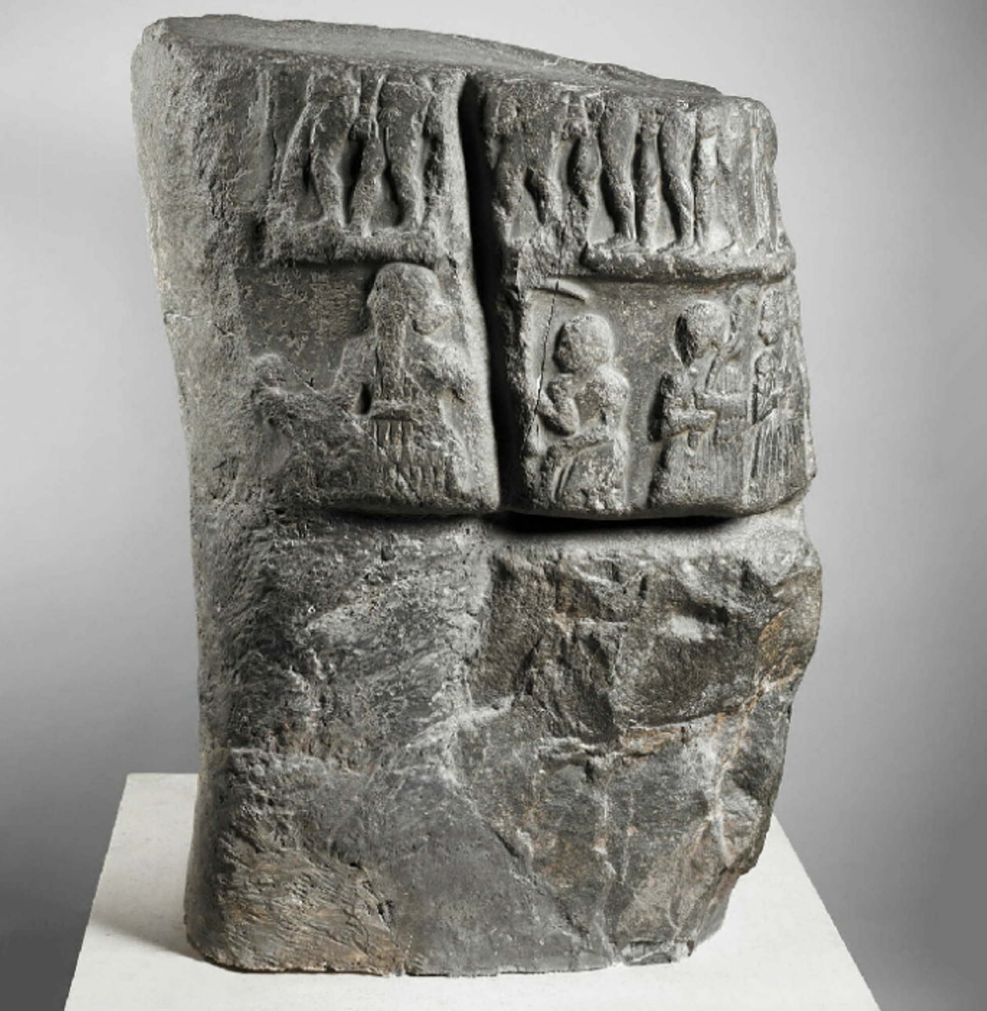 Base of a stela decorated on two registers with the victory scene from Sargon of Akkad.