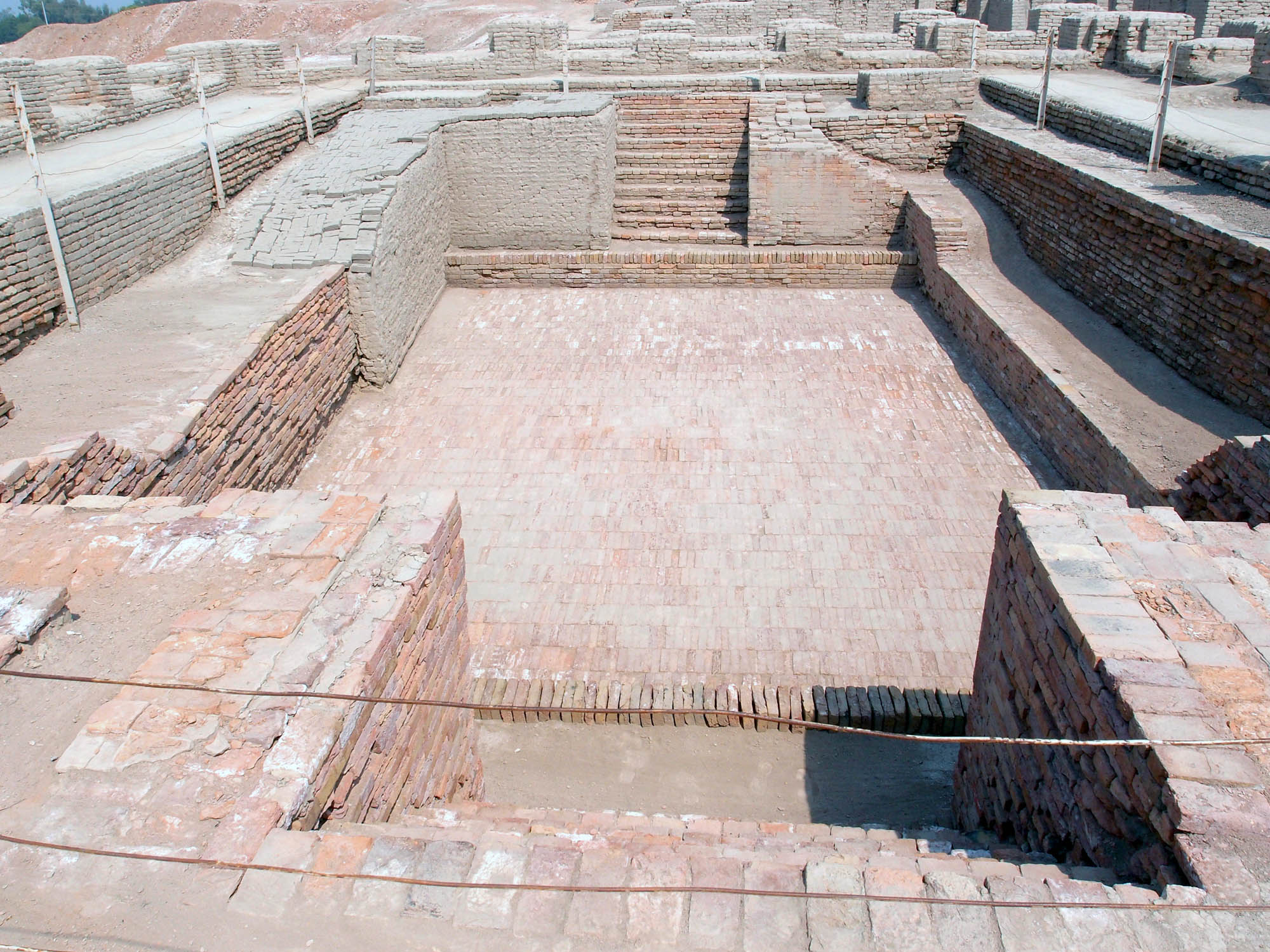 A photo of an empty pool made of brick