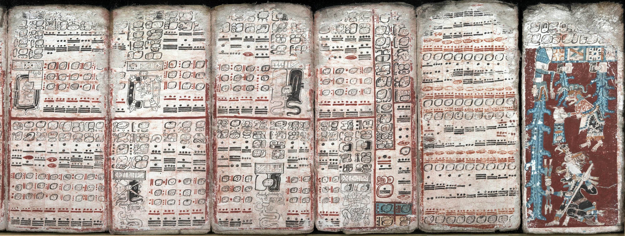 A paneled, painted manuscript featuring language symbols and detailed art