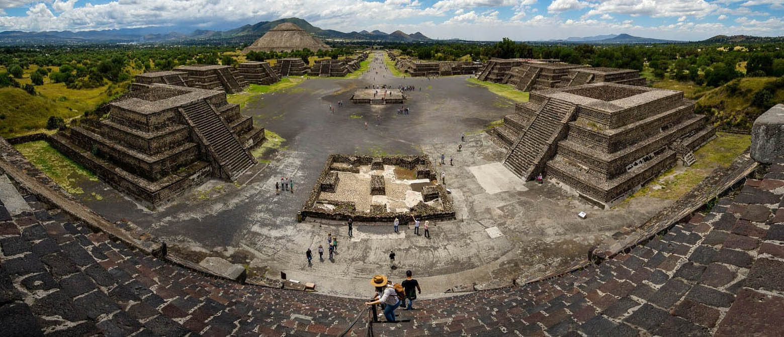 Panoramic photograph of impressive, pyramid-like structures that made up Teotihuacan.