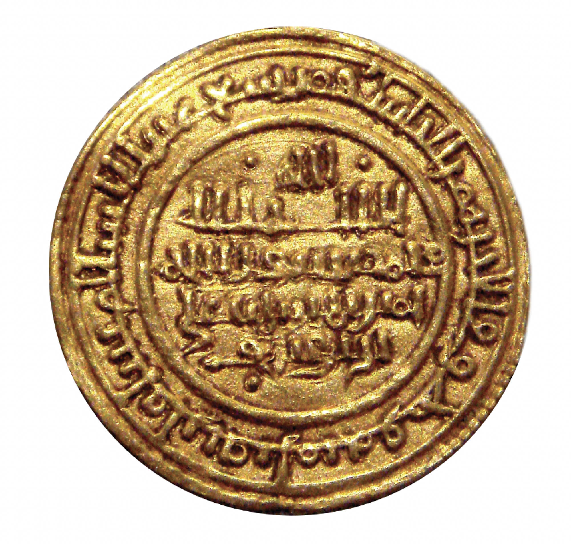 A gold coin carved with text.