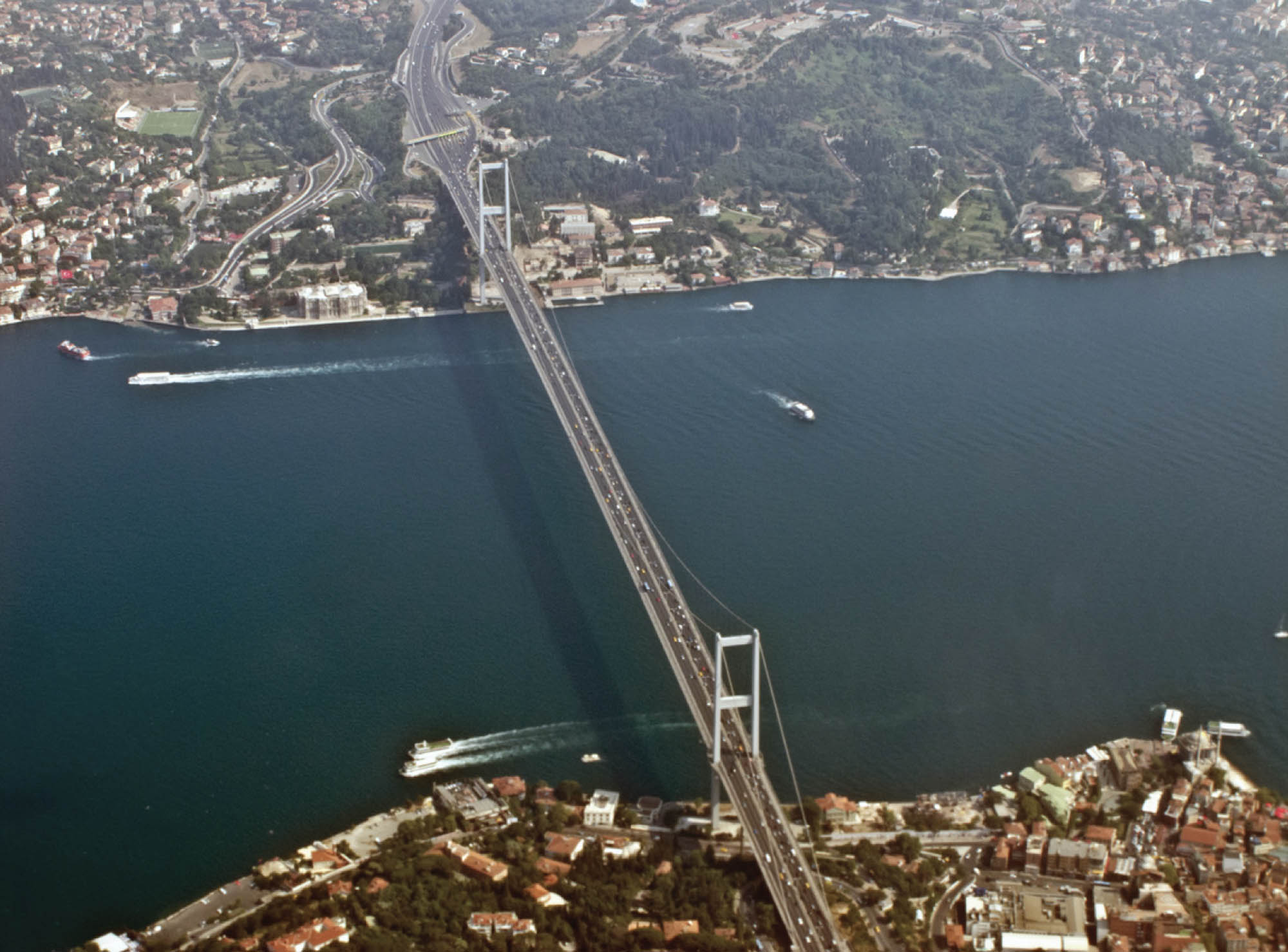 A birds-eye photograph of a great bridge, connecting two continents.