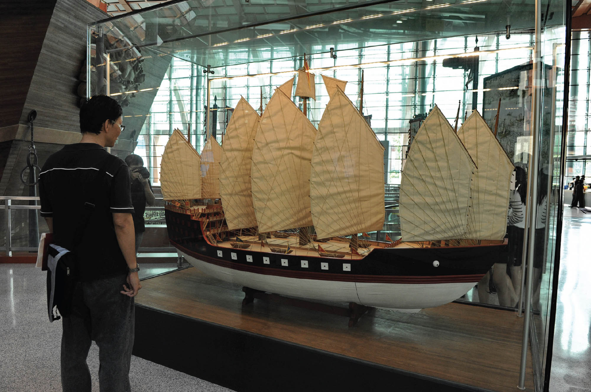 An intricate model of ships in a museum display.