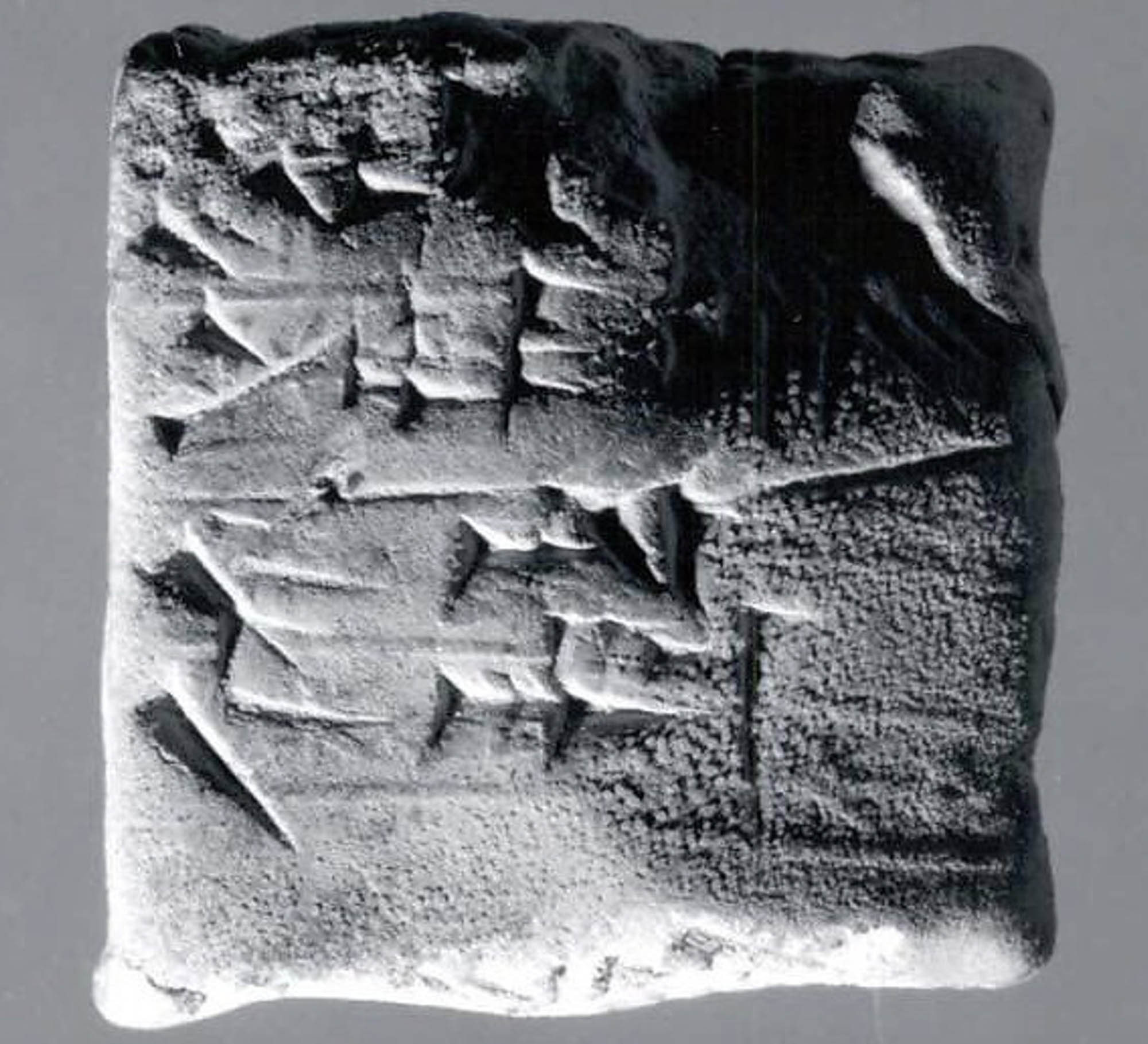 Cuneiform tablet carved with wedge-shaped characters.