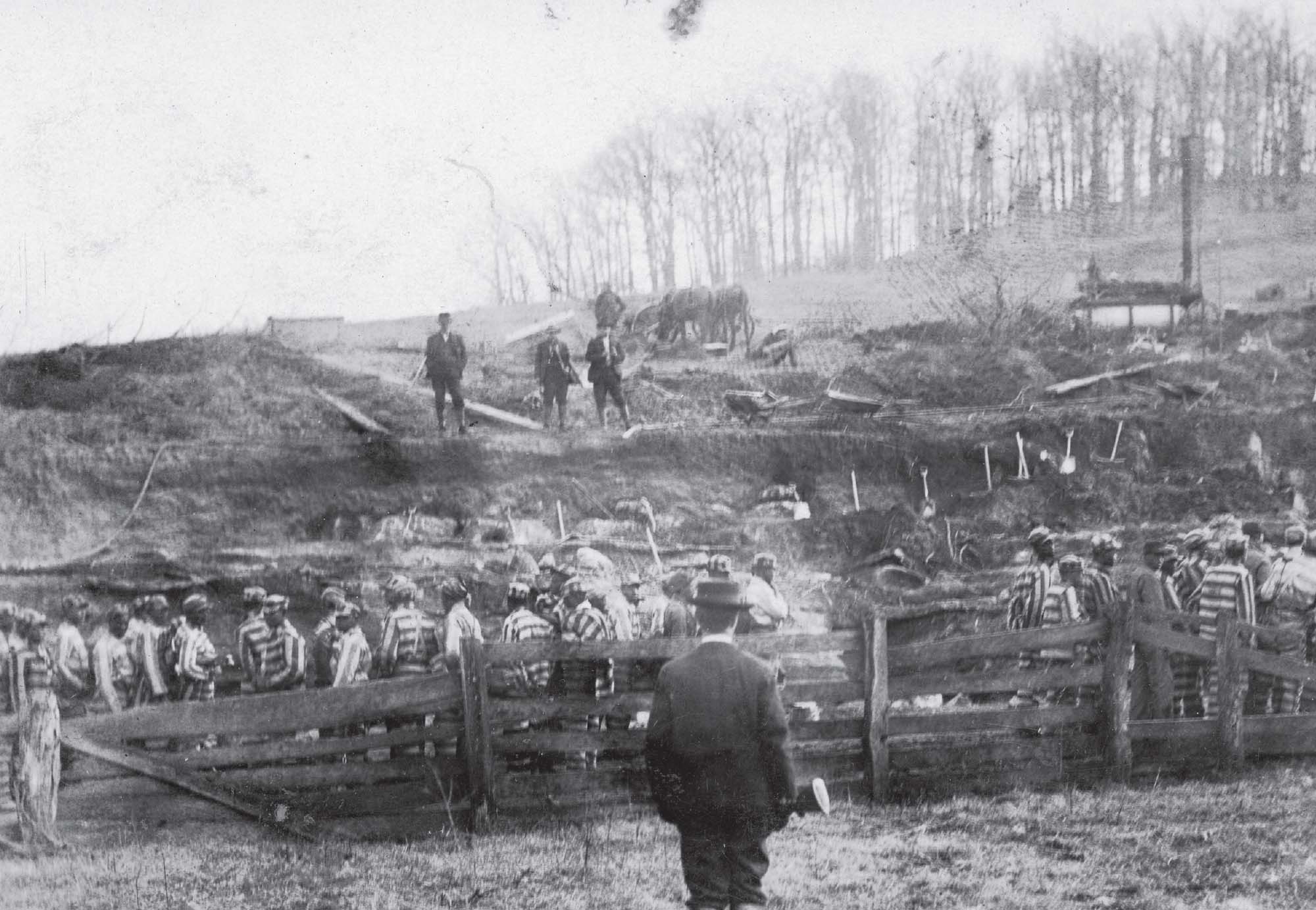 Black male laborers in prison uniforms with armed guards overseeing their labor.