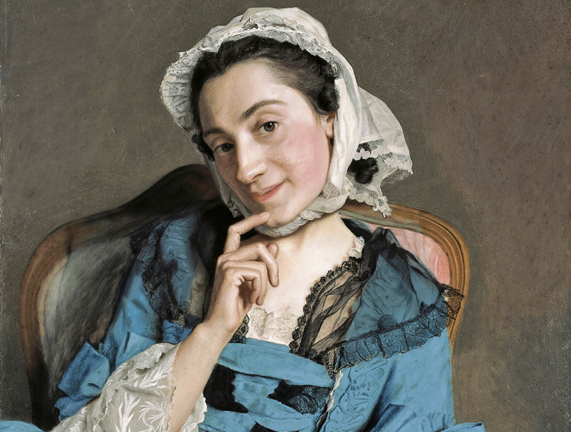 Portrait of Louise d’Épinay in a blue dress and white bonnet with her hand resting on her chin.