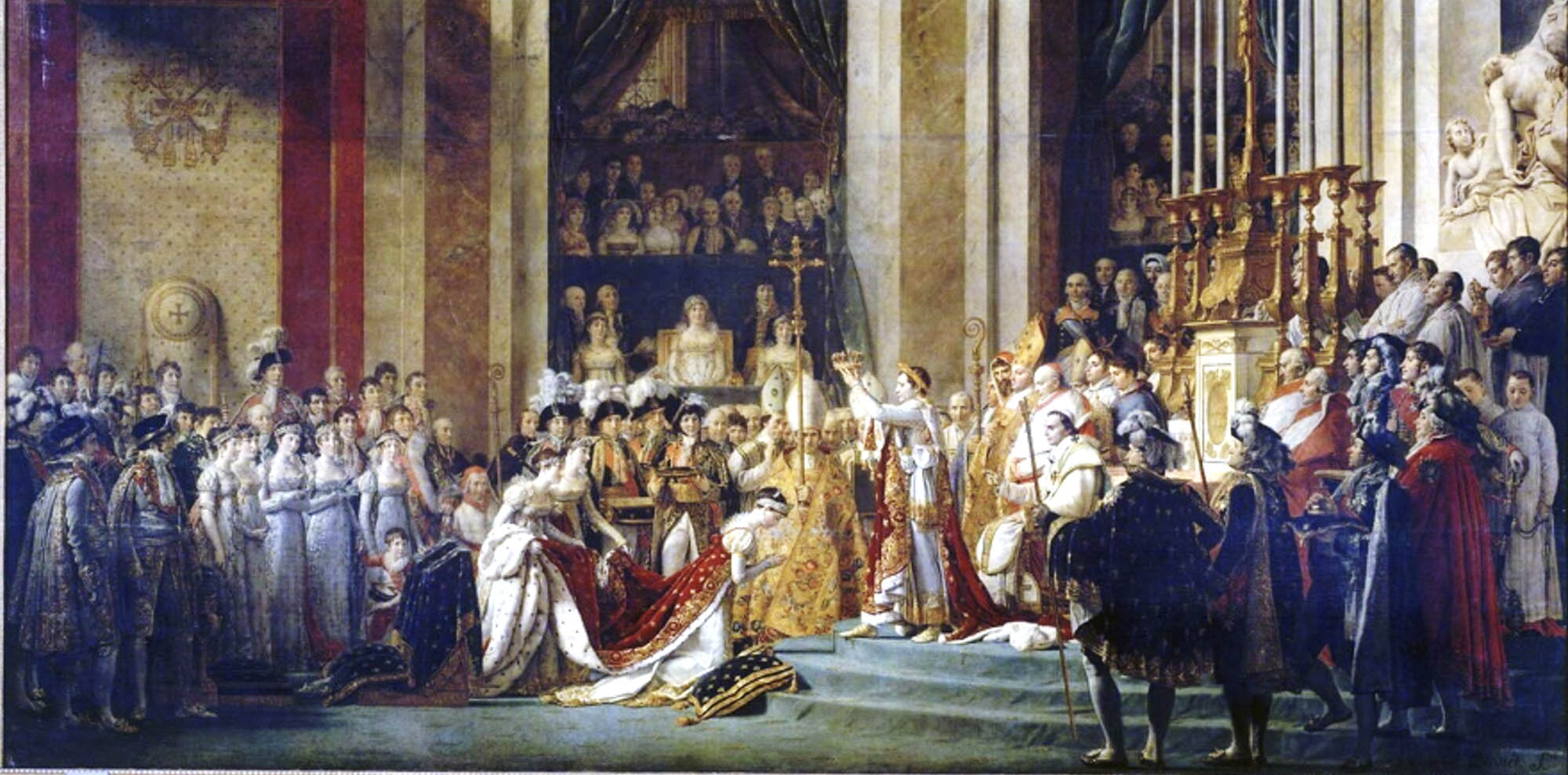 A painting of Napoleon crowning a kneeling woman amongst various dignitaries and officials, the room is ornate with high ceilings, columns, and religious iconography.