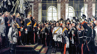 A group of men in uniform representing military leaders and dignitaries, all gathered to witness a historical moment in a regal room.