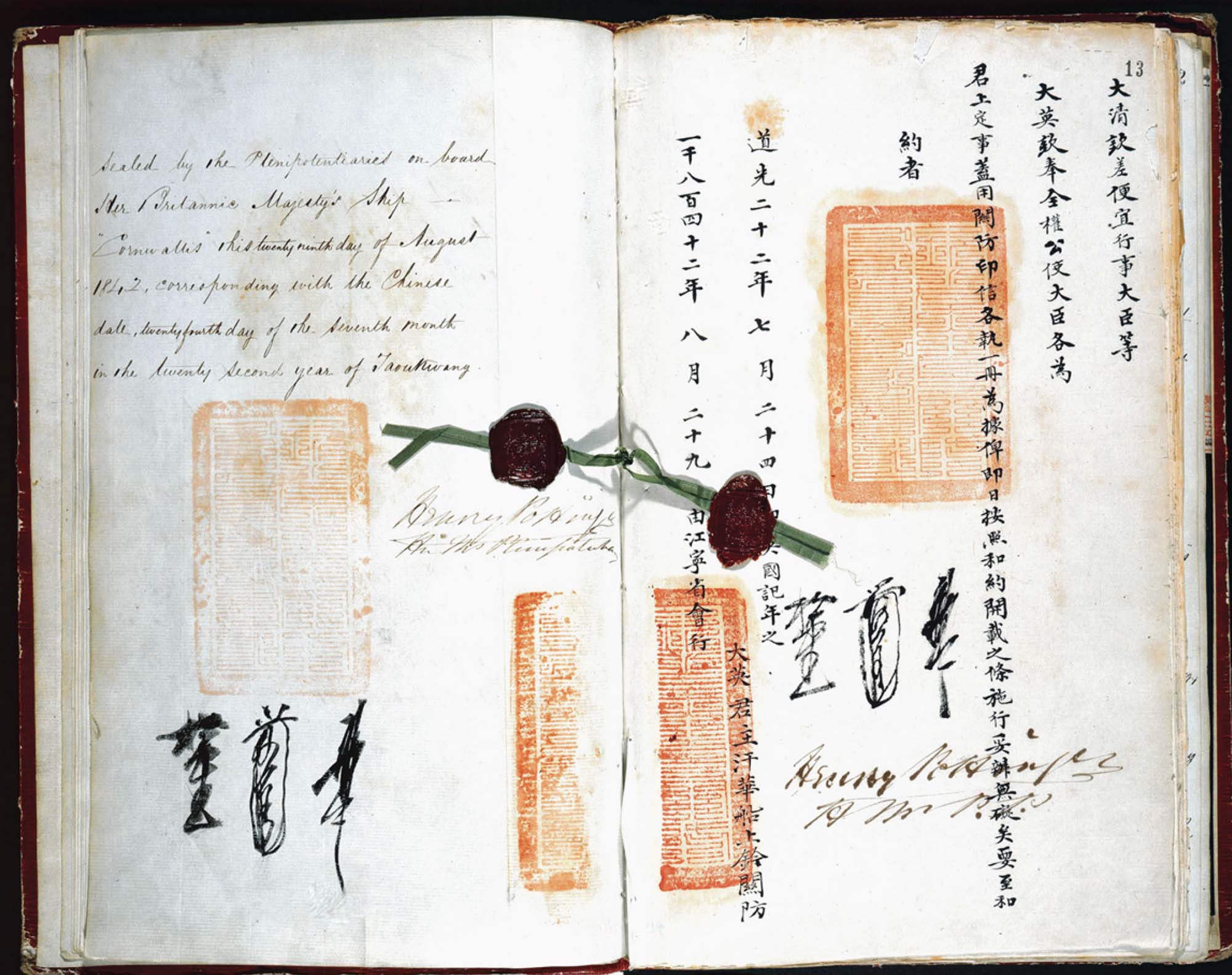 An open book with writing representing the bilingual Treaty of Nanjing and featuring the seals of the British and Qing governments.