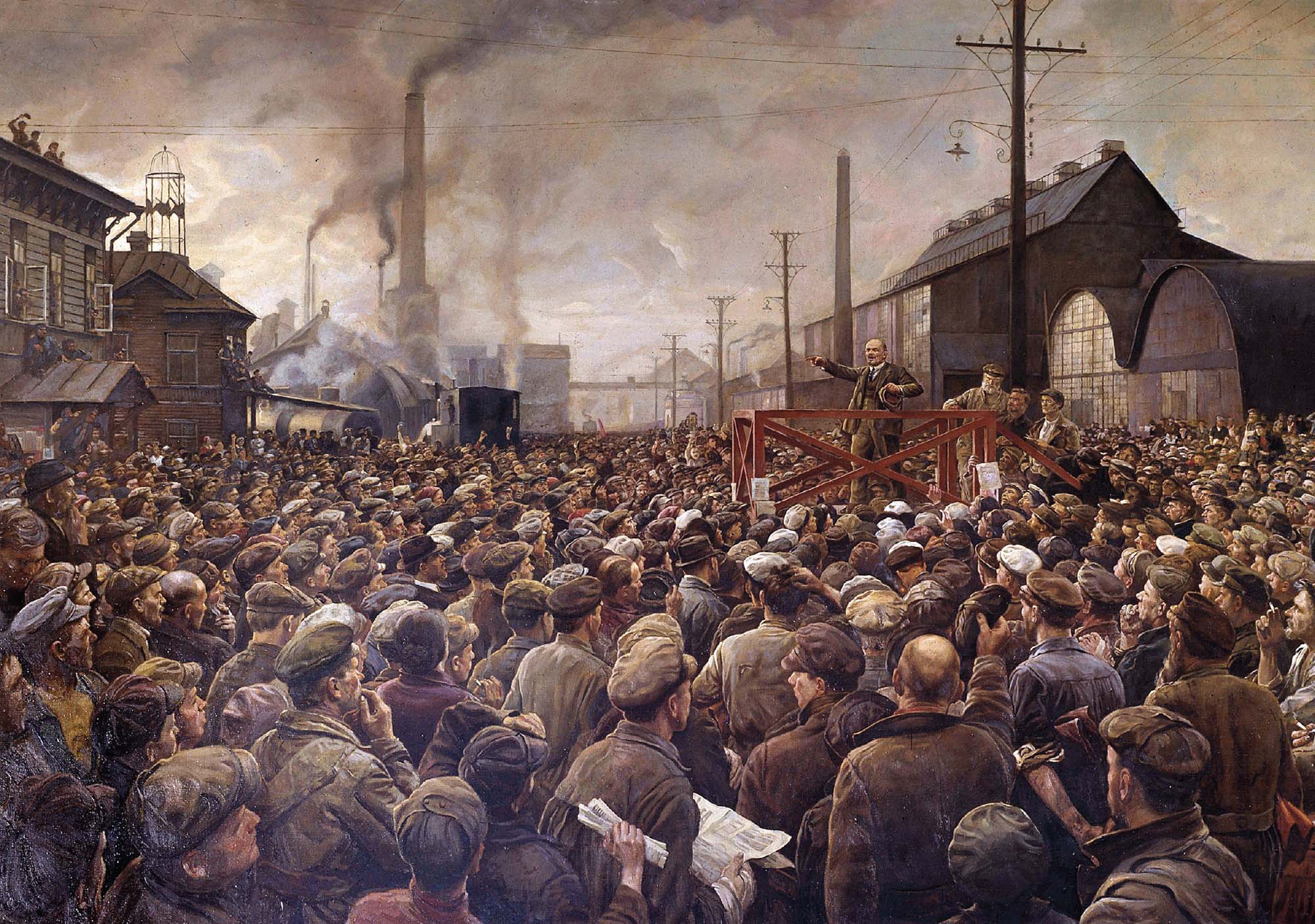 Painted depiction shows a large crowd of people crowded around a person standing on a platform in the middle of an industrial street.