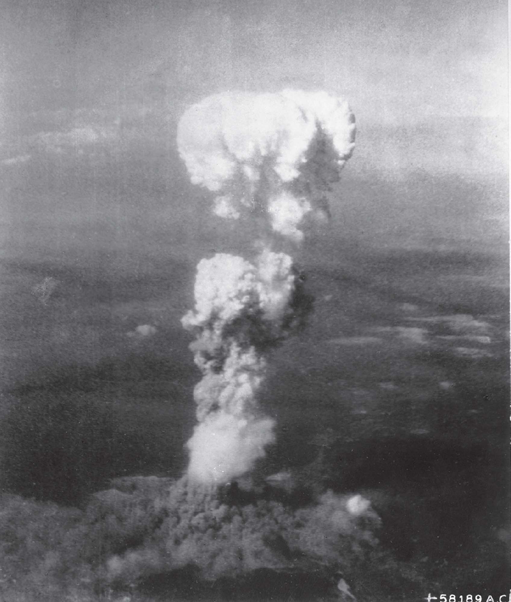 A far-away image of a giant, mushroom-shaped cloud erupting.