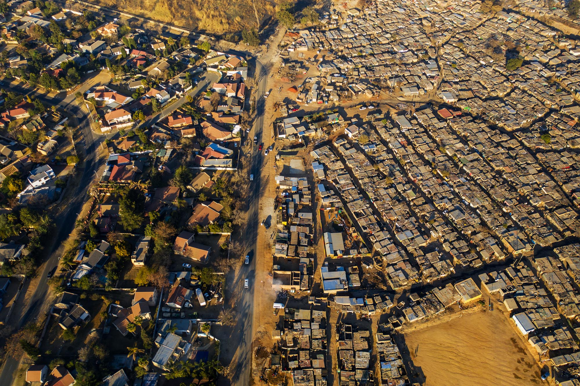 Overhead view of strict divide between rich and poor neighborhoods in Johannesburg, South Africa.